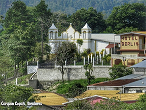 A village scene in Corquín, Copán, Honduras, featuring local architecture near coffee farms, where smallholder farmers produce organic, sustainably grown coffee beans.