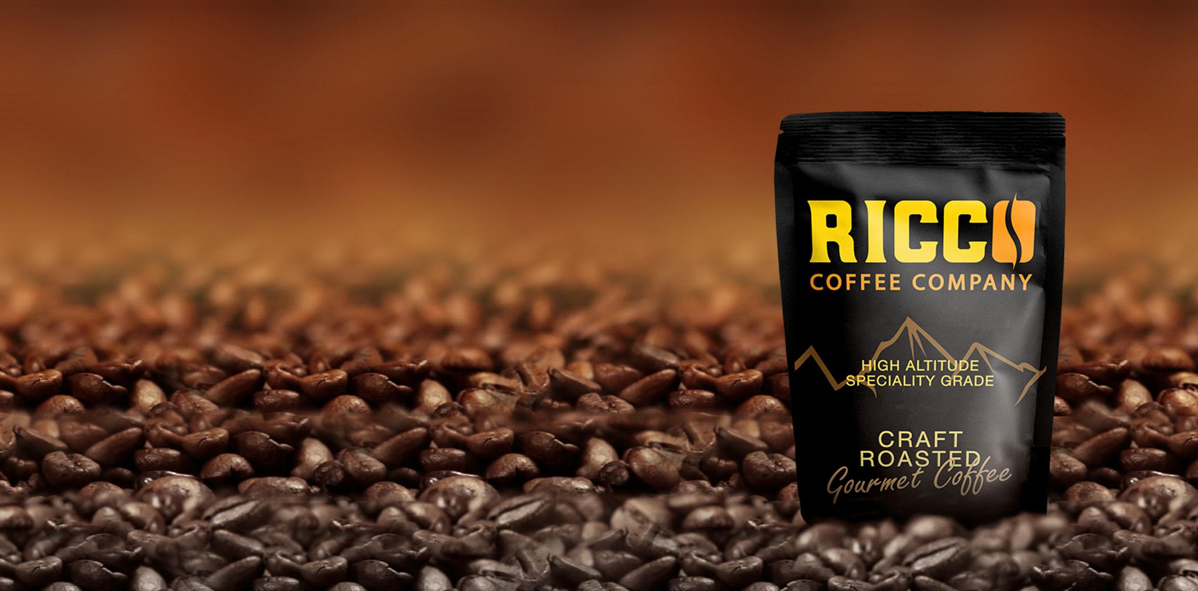 Homepage banner for Ricco Coffee Company featuring a craft roasted gourmet coffee bag on a bed of specialty-grade coffee beans